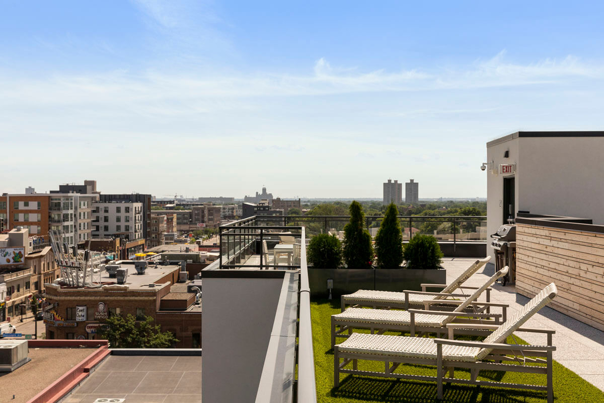 Rooftop entertainment area fire pit and beautiful views of Uptown neighborhood